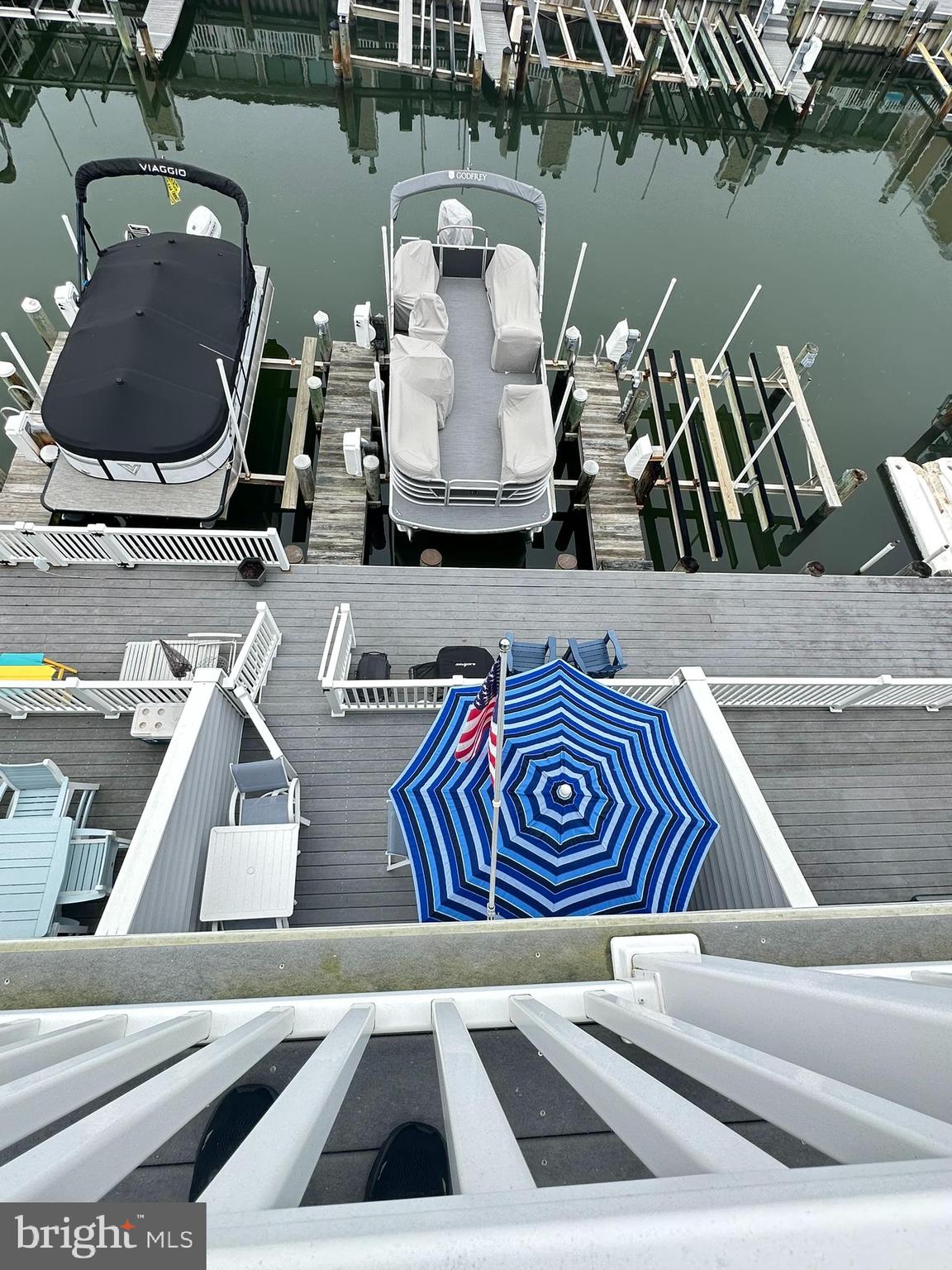 712 Mooring Road Ocean City, MD 21842 - Photo 51 of 60 a view of roof deck with table and chairs