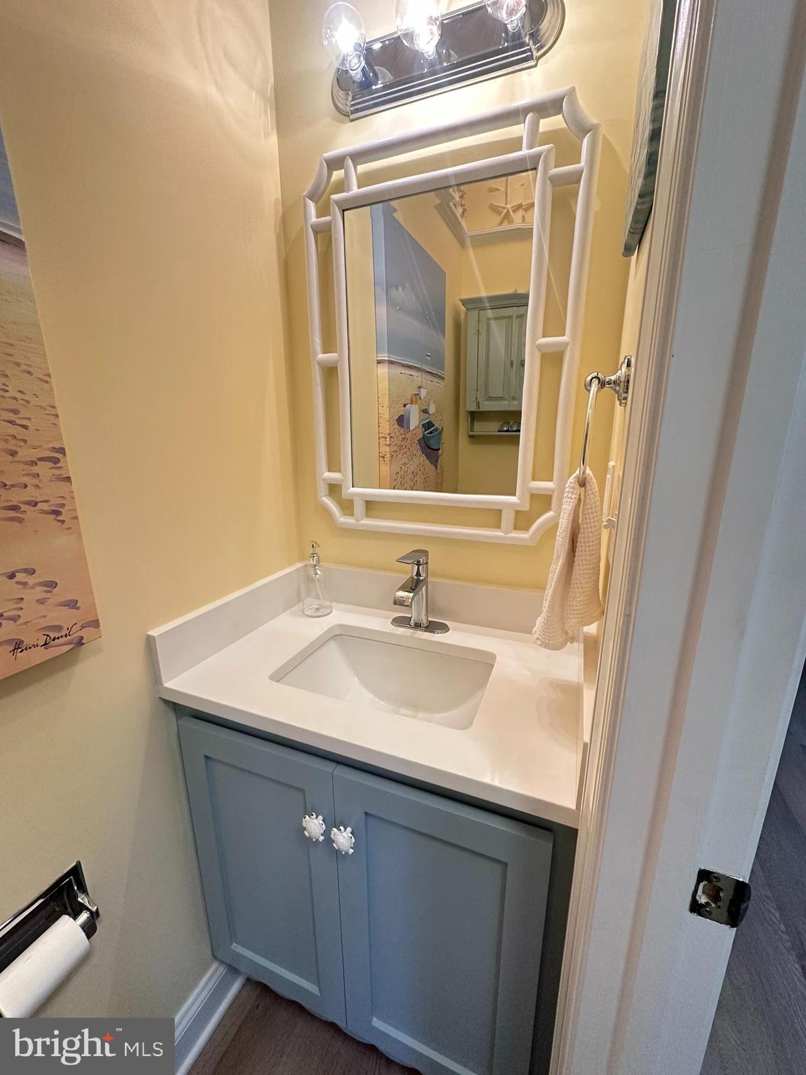 712 Mooring Road Ocean City, MD 21842 - Photo 57 of 60 a bathroom with a sink and a mirror