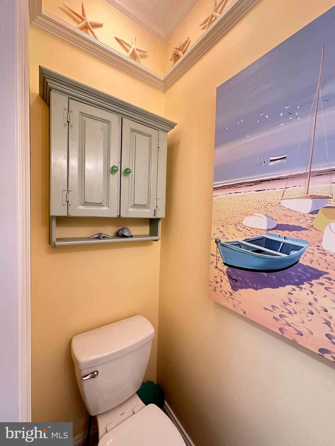 712 Mooring Road Ocean City, MD 21842 - Photo 58 of 60 a bathroom with a toilet and a sink