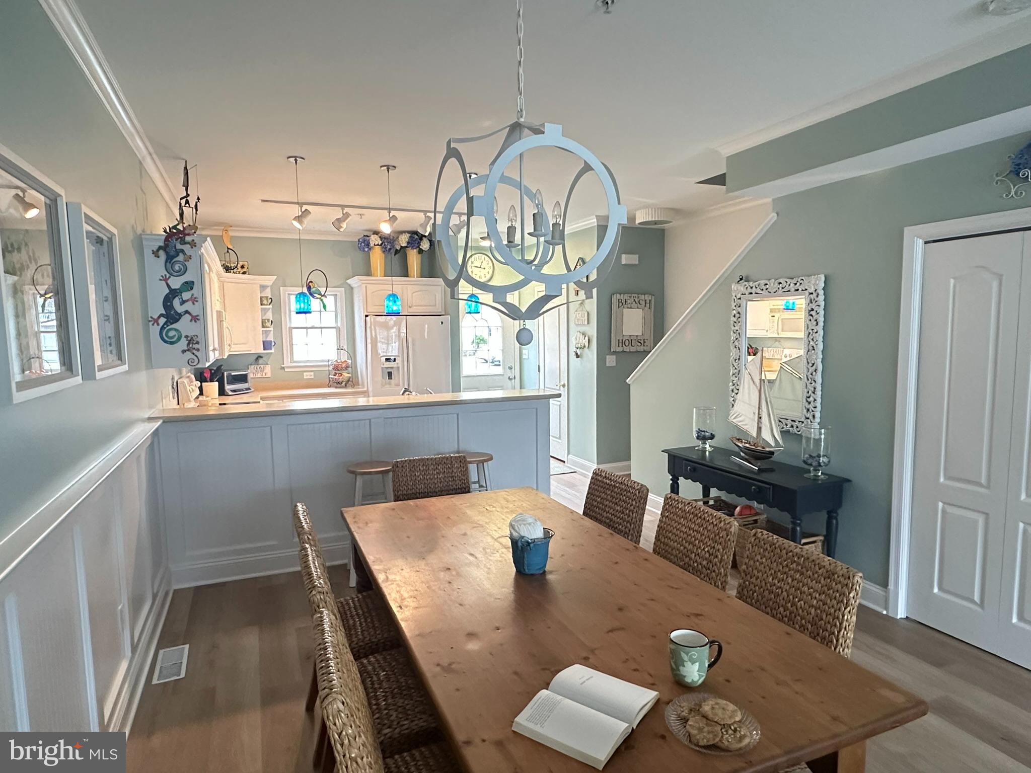 712 Mooring Road Ocean City, MD 21842 - Photo 8 of 60 a view of kitchen and dining room with wooden floor