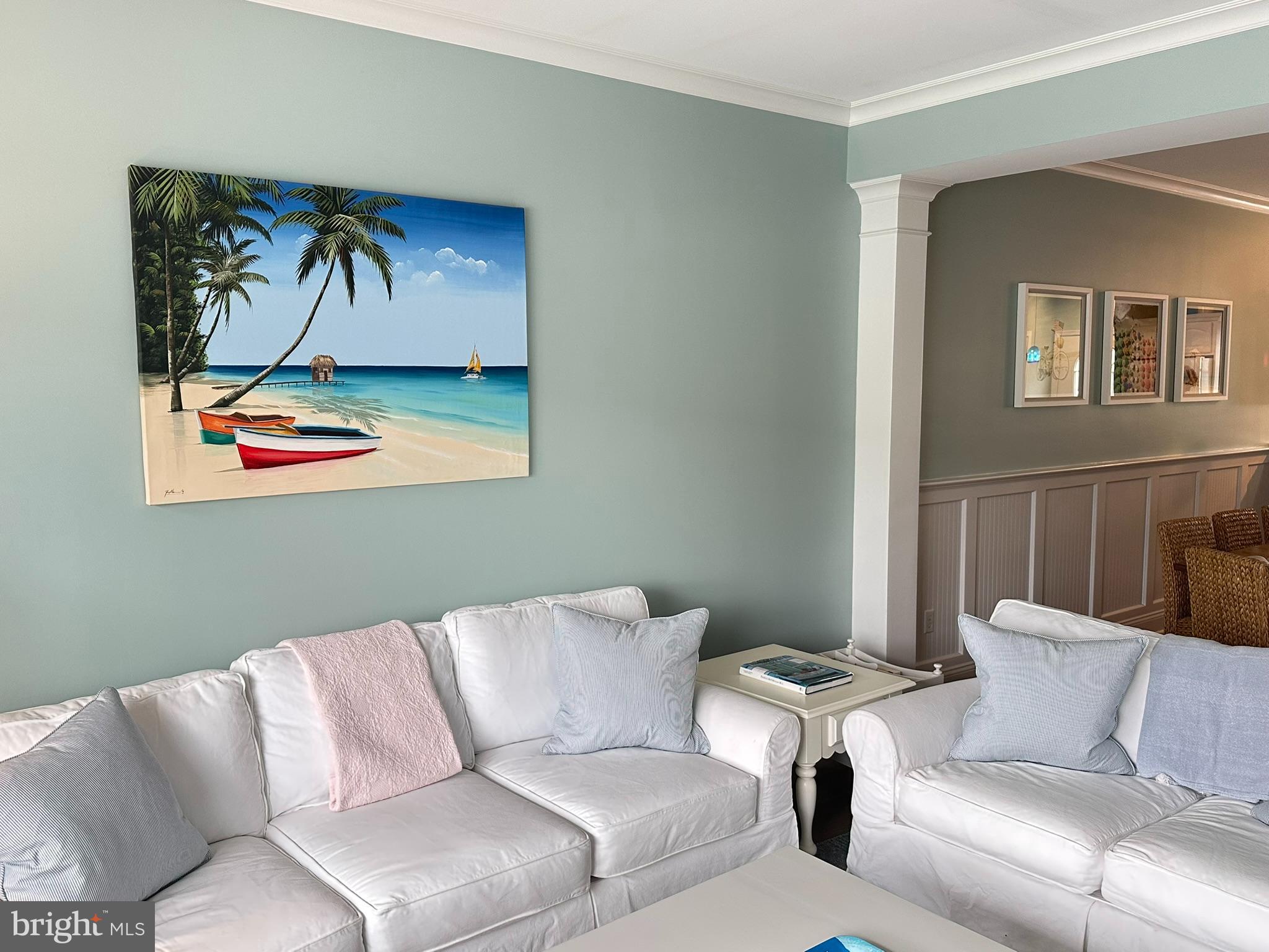 712 Mooring Road Ocean City, MD 21842 - Photo 9 of 60 a living room with furniture and a painting on the wall