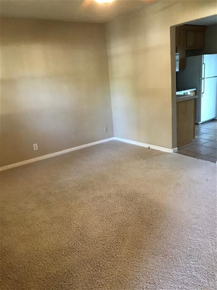 7606 Randy Road Machesney Park, IL 61115 - Photo 3 of 14 a view of an empty room and a kitchen