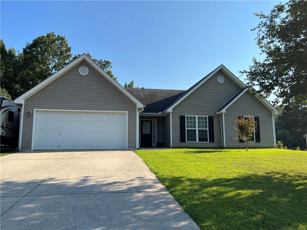 1941 Diamond Ridge Drive Statham, GA 30666 - Photo 1 of 1 a view of house with yard and trees in the background