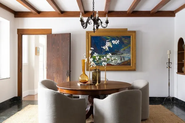 a dining room with furniture and window