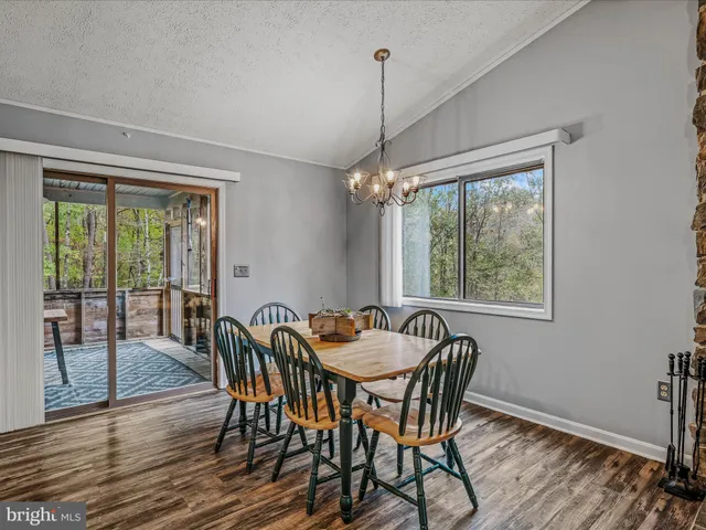 a dining room with furniture window wooden floor