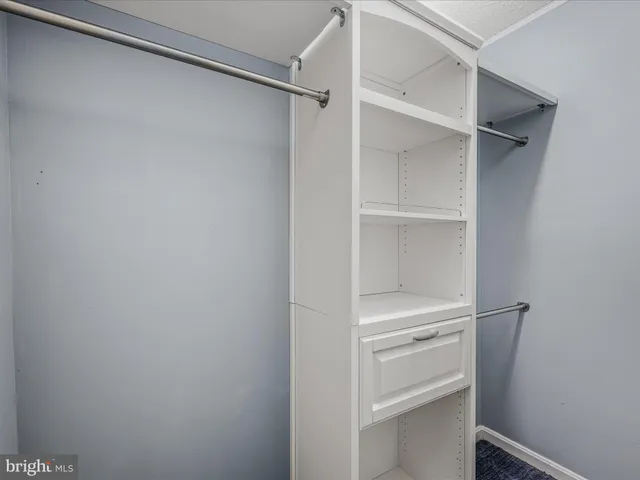 a view of an empty walk in closet