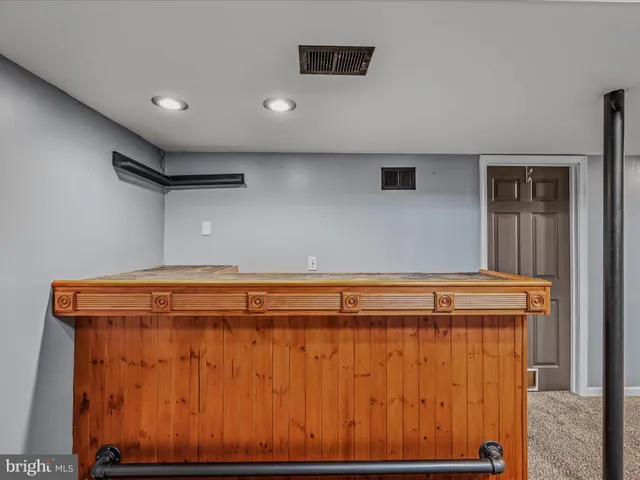 a view of a room with wooden walls