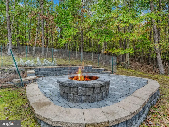a view of a wooden floor with a sitting in a backyard