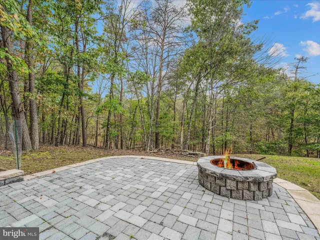 a view of a backyard of the house