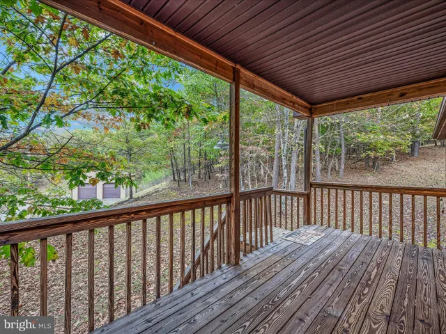 a view of balcony with wooden floor