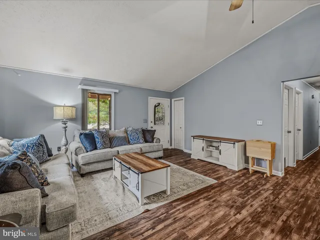a living room with furniture and a table
