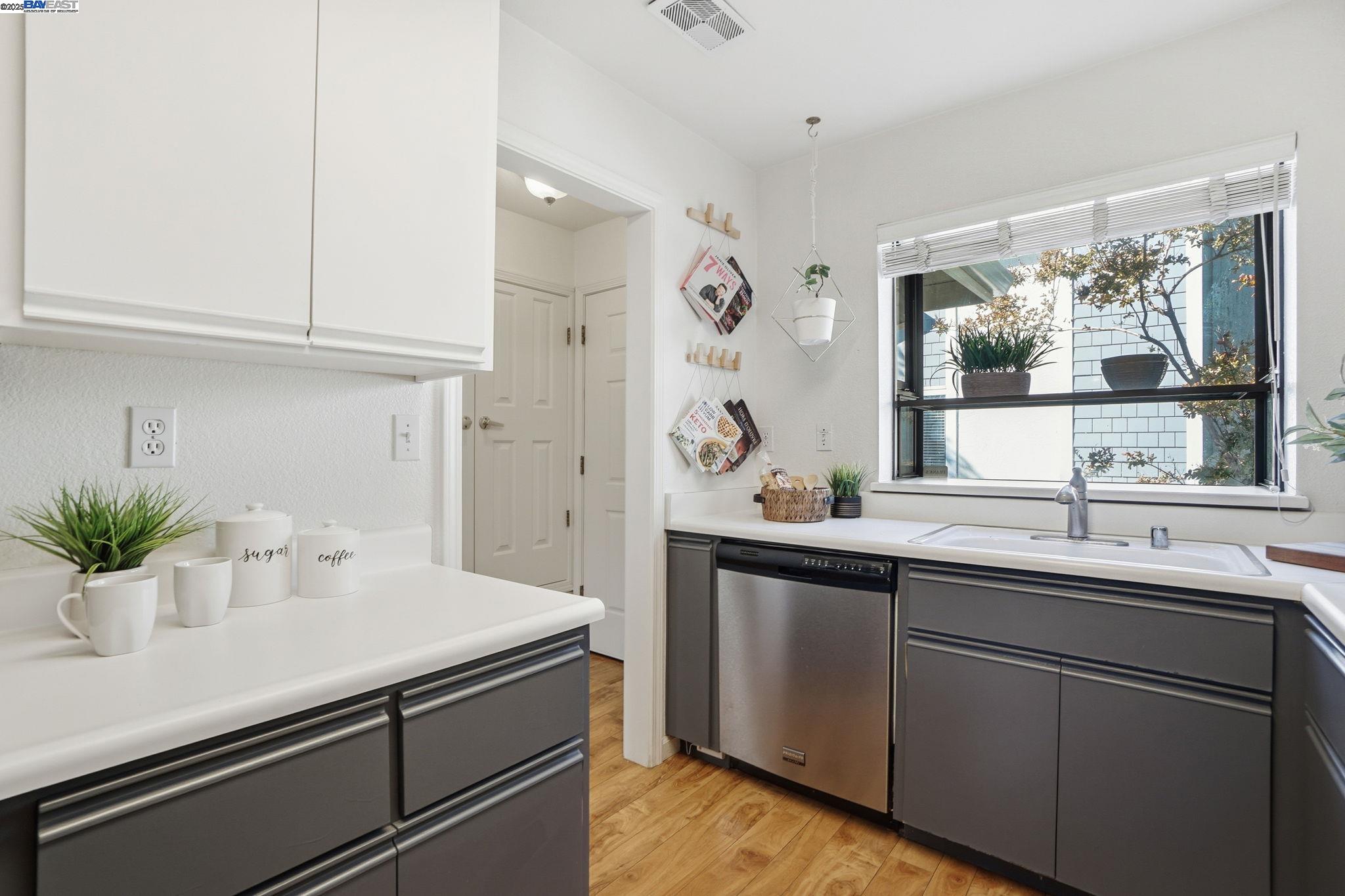 2586 Oak Road, Unit 229 Walnut Creek, CA 94597 - Photo 13 of 39 a kitchen with a sink and cabinets