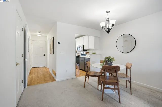 a bedroom with bed and a potted plant