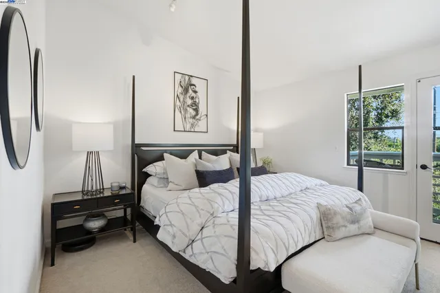 a bedroom with bed and a window