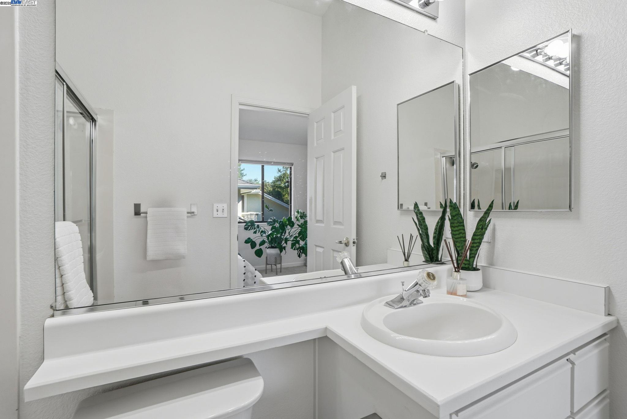 2586 Oak Road, Unit 229 Walnut Creek, CA 94597 - Photo 27 of 39 a bathroom with a sink and a mirror