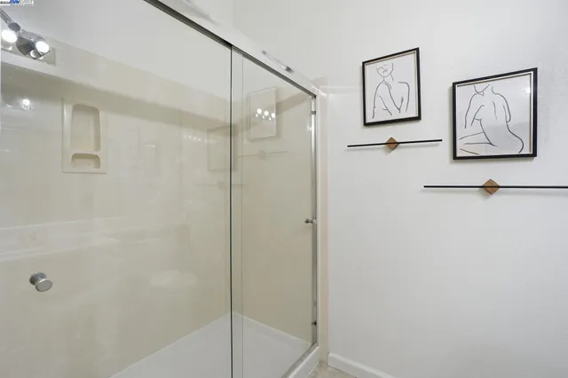 a view of a hallway with washer and dryer