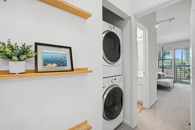 a view of a hallway with washer and dryer