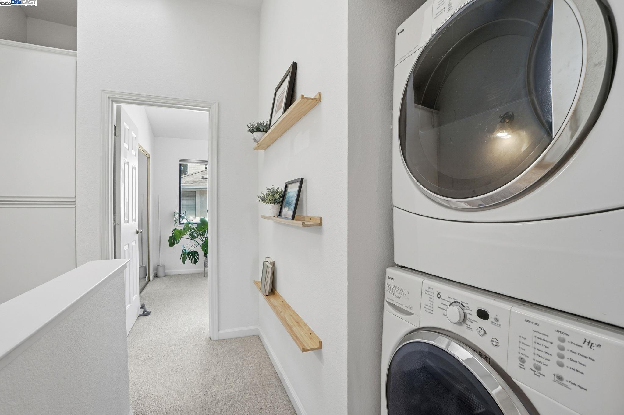2586 Oak Road, Unit 229 Walnut Creek, CA 94597 - Photo 32 of 39 a view of a hallway with washer and dryer