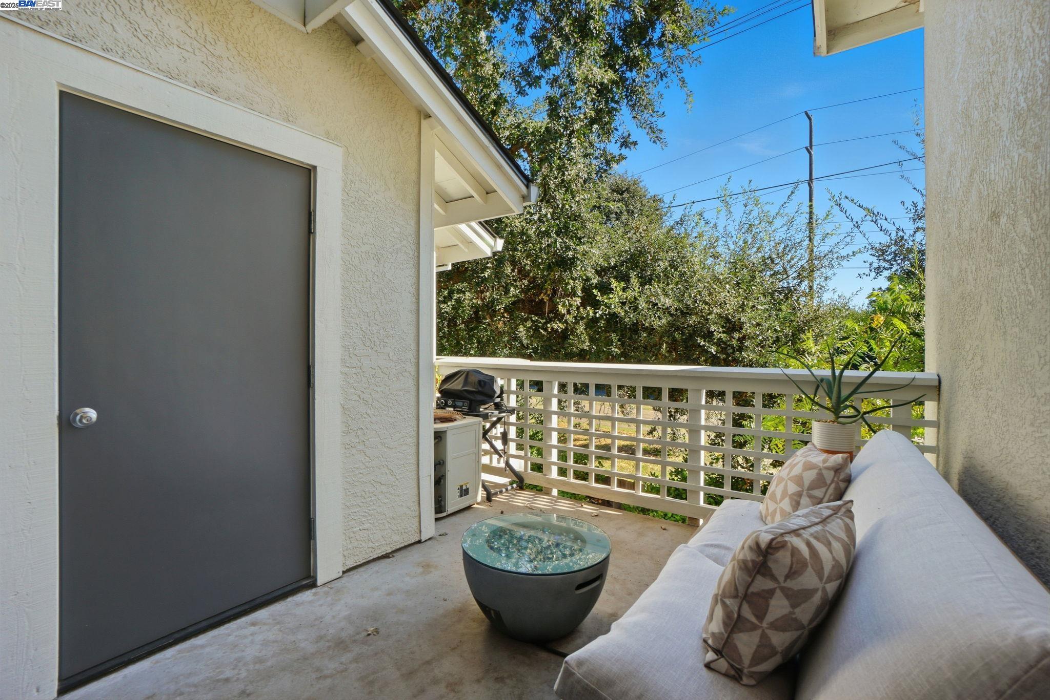 2586 Oak Road, Unit 229 Walnut Creek, CA 94597 - Photo 35 of 39 a view of a balcony with chair and potted plant