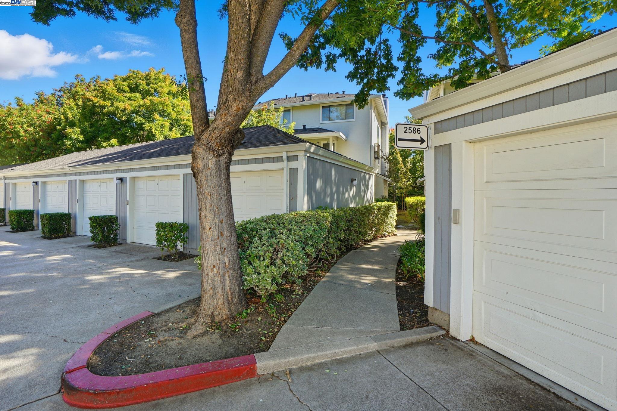 2586 Oak Road, Unit 229 Walnut Creek, CA 94597 - Photo 39 of 39 a front view of a house with garden
