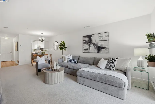 a kitchen with a sink a stove and cabinets