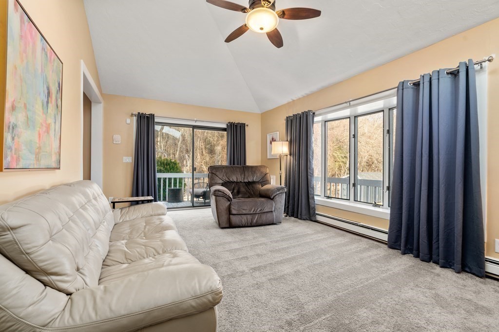 238 West Acton Road Stow, MA 01775 - Photo 13 of 37 a living room with furniture and a large window