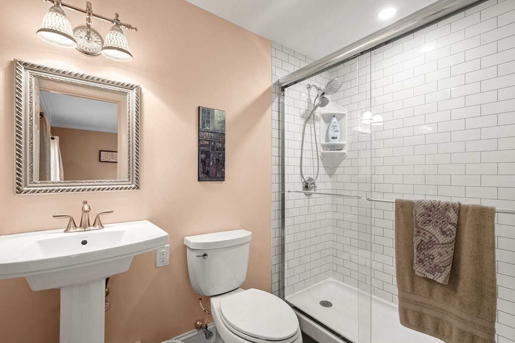 238 West Acton Road Stow, MA 01775 - Photo 14 of 37 a bathroom with a toilet sink and shower