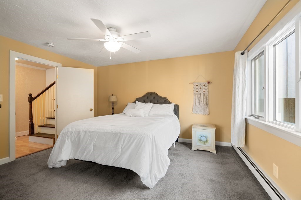 238 West Acton Road Stow, MA 01775 - Photo 15 of 37 a bedroom with a bed and a window