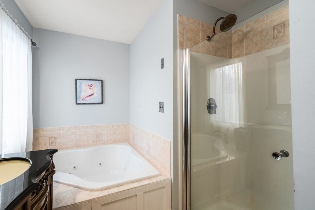 238 West Acton Road Stow, MA 01775 - Photo 17 of 37 a bathroom with a tub and shower