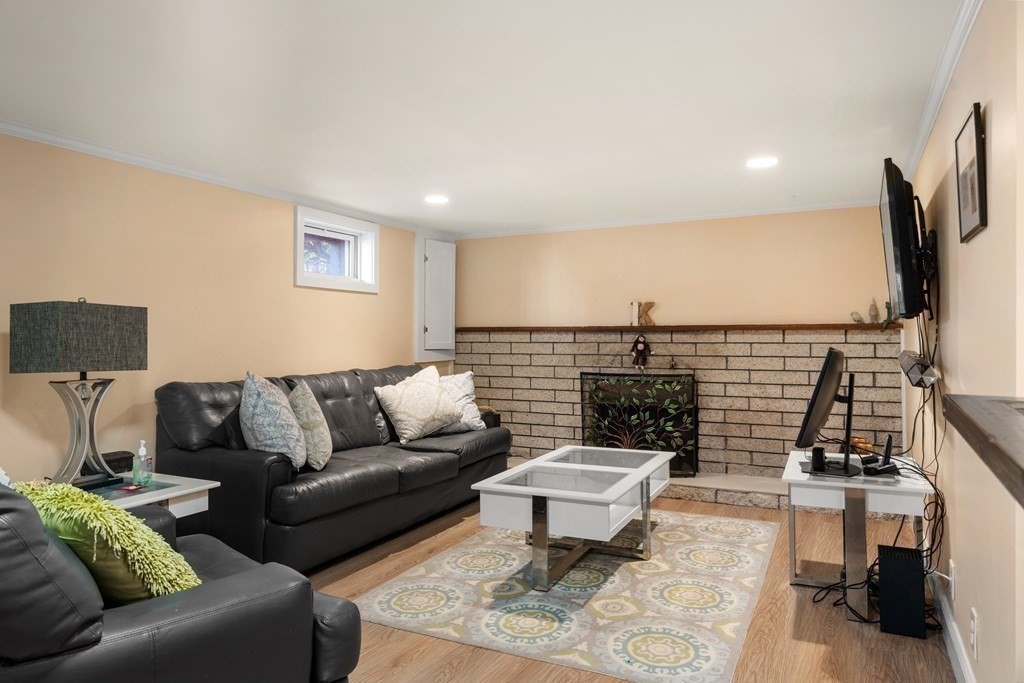 238 West Acton Road Stow, MA 01775 - Photo 22 of 37 a living room with furniture and a flat screen tv