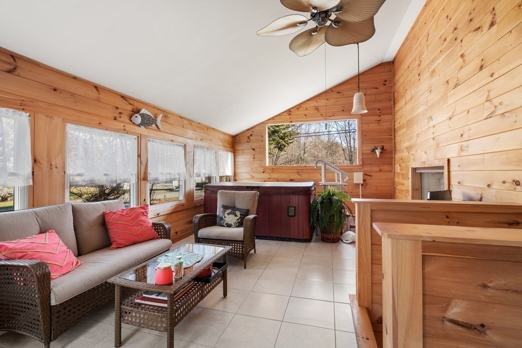 238 West Acton Road Stow, MA 01775 - Photo 4 of 37 a outdoor space with patio furniture and a fireplace