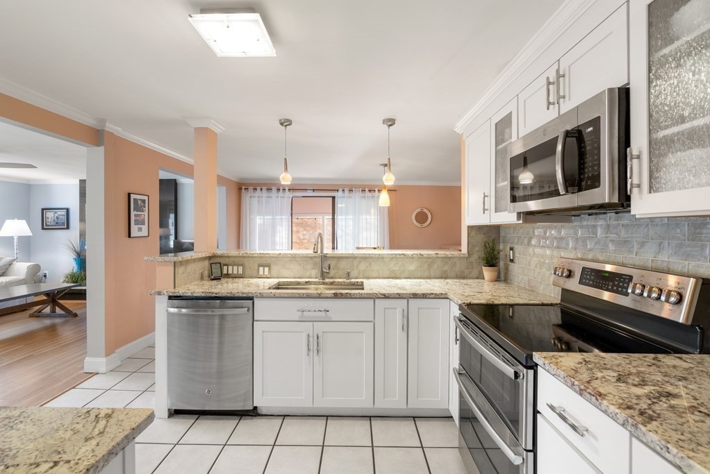 238 West Acton Road Stow, MA 01775 - Photo 8 of 37 a kitchen with a sink stove and microwave