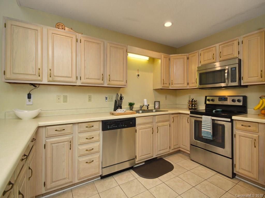 39 Forest Road Canton, NC 28716 - Photo 11 of 18 a kitchen with cabinets stainless steel appliances and a sink
