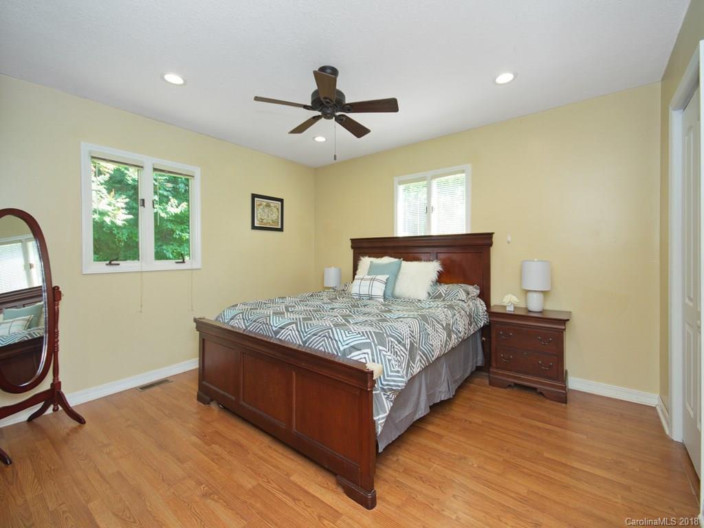 39 Forest Road Canton, NC 28716 - Photo 12 of 18 a bedroom with a bed and a window