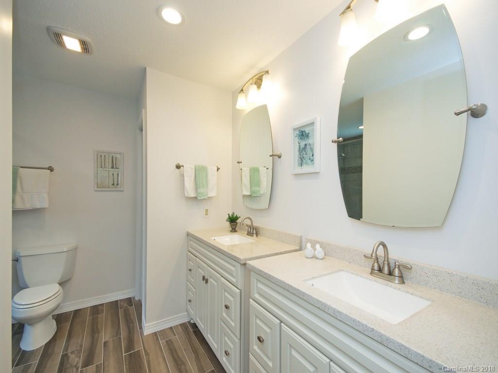 39 Forest Road Canton, NC 28716 - Photo 13 of 18 a bathroom with a sink a toilet and a mirror