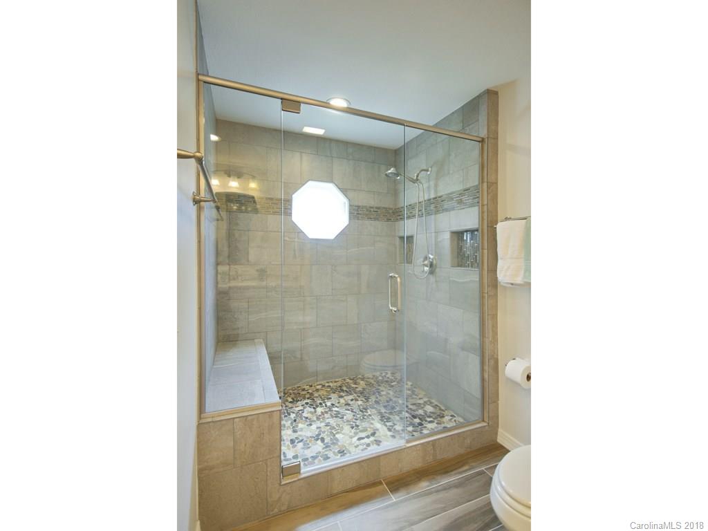 39 Forest Road Canton, NC 28716 - Photo 14 of 18 a bathroom with a shower and mirror