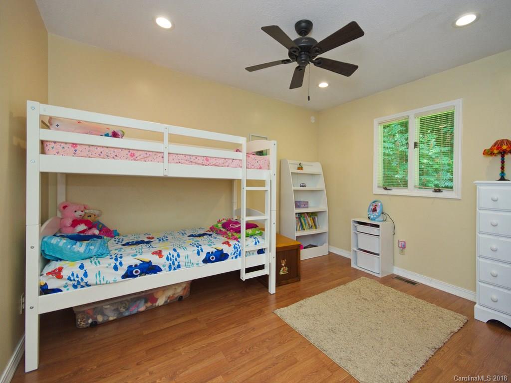 39 Forest Road Canton, NC 28716 - Photo 15 of 18 a children room with toys and a wooden floor