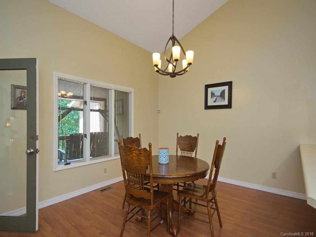 39 Forest Road Canton, NC 28716 - Photo 5 of 18 a view of a dining room with a table and chairs