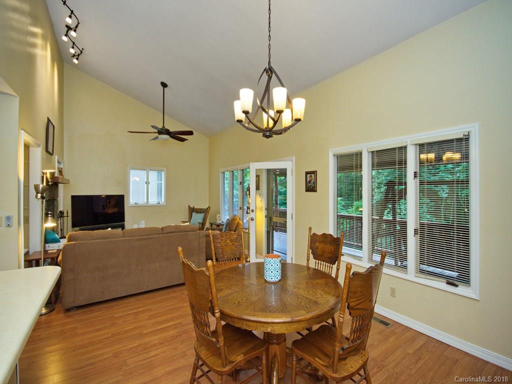 39 Forest Road Canton, NC 28716 - Photo 9 of 18 a view of a dining room with furniture wooden floor and chandelier