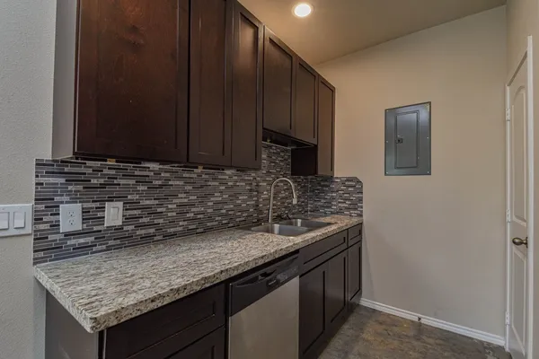 a kitchen with a sink and cabinets