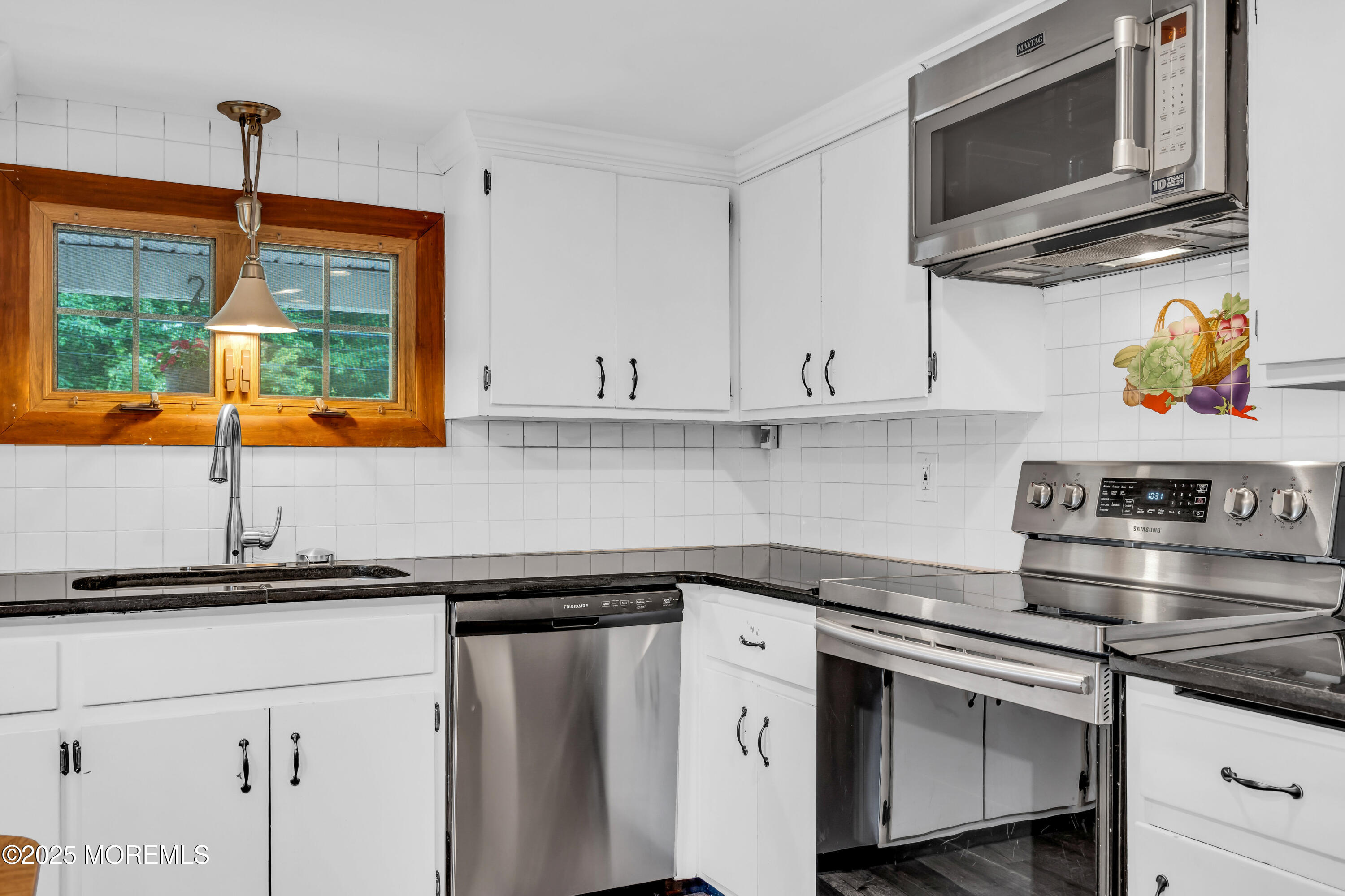 840 Farmingdale Road Jackson, NJ 08527 - Photo 23 of 70 a kitchen with stainless steel appliances granite countertop a sink and a microwave