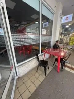 a patio with table and chairs