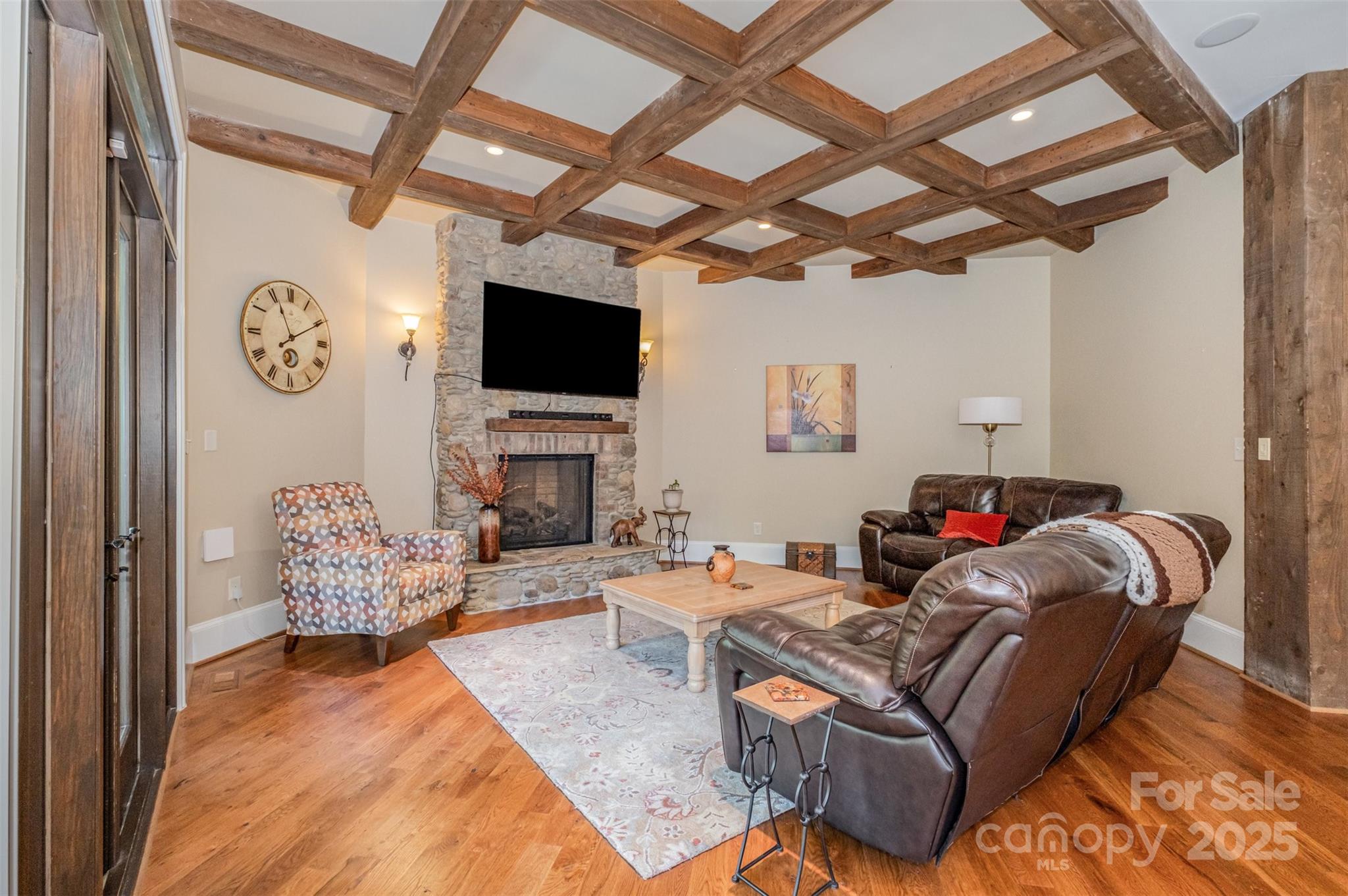 1610 Lookout Circle Waxhaw, NC 28173 - Photo 12 of 44 a living room with furniture a fireplace and a flat screen tv
