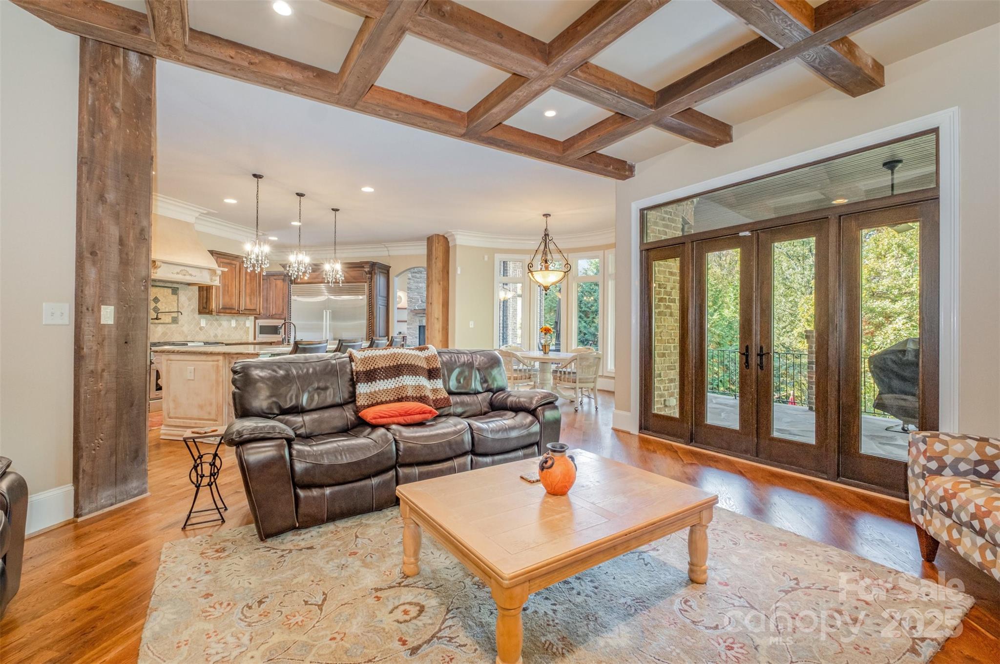 1610 Lookout Circle Waxhaw, NC 28173 - Photo 13 of 44 a living room with furniture a rug and a chandelier