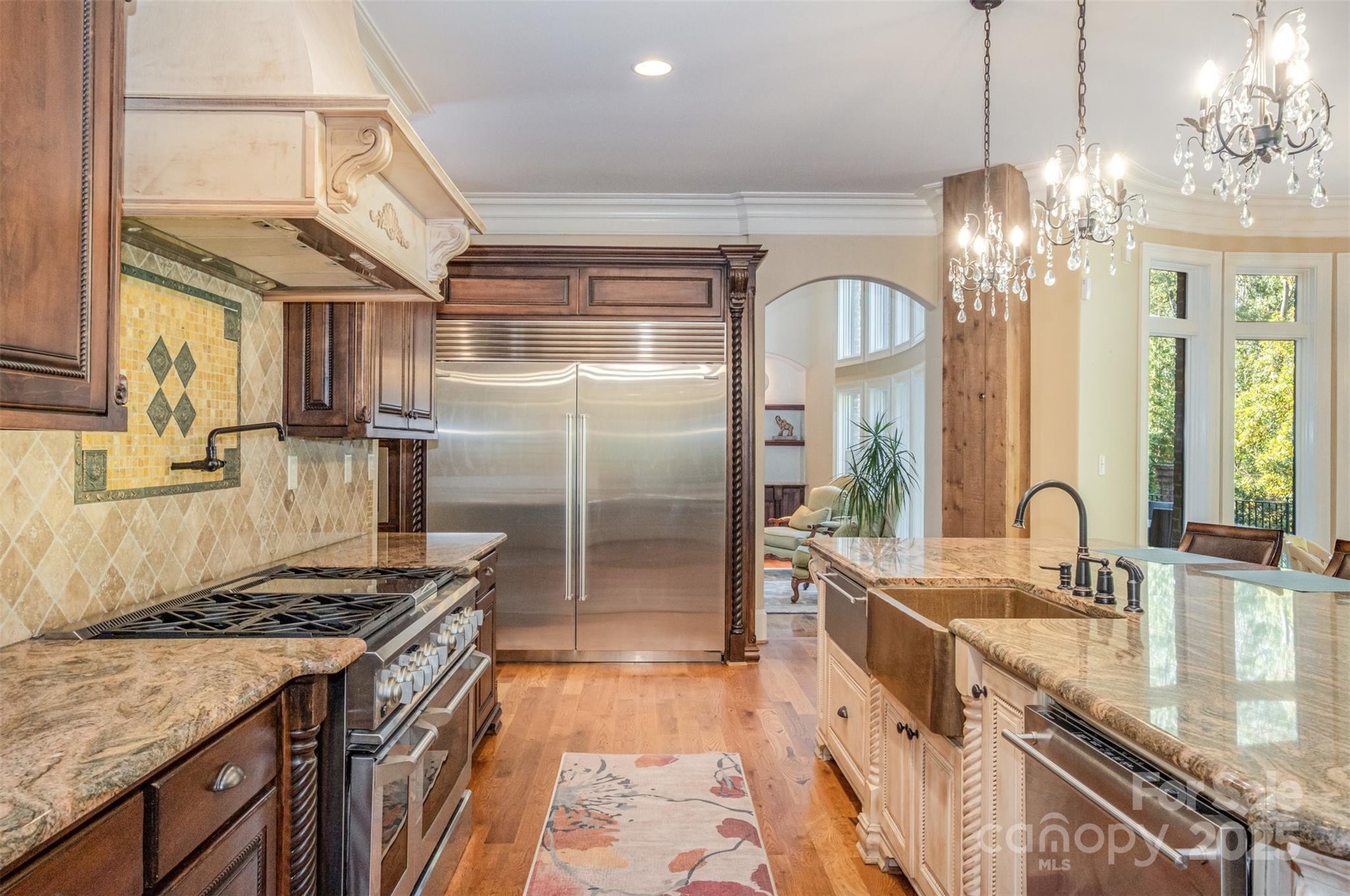 1610 Lookout Circle Waxhaw, NC 28173 - Photo 17 of 44 a kitchen with granite countertop a sink stainless steel appliances a counter space and a window