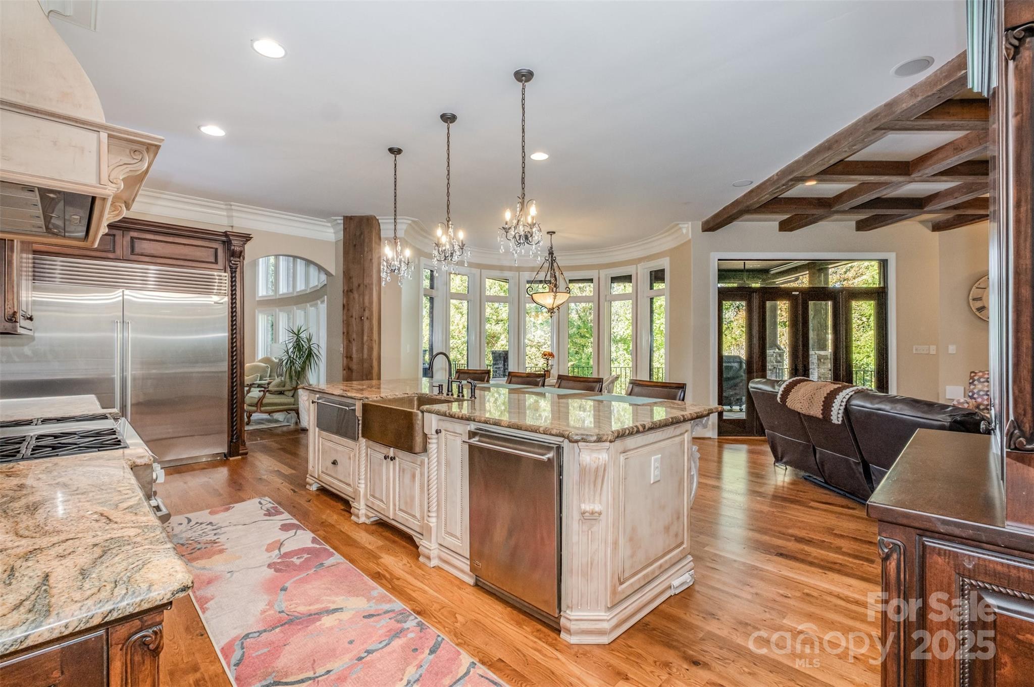 1610 Lookout Circle Waxhaw, NC 28173 - Photo 18 of 44 a large kitchen with kitchen island granite countertop a large counter top and stainless steel appliances