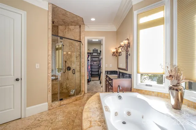 a bathroom with a sink a mirror and a shower