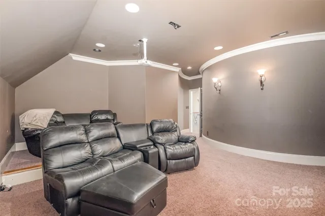 a living room with furniture and a dining table