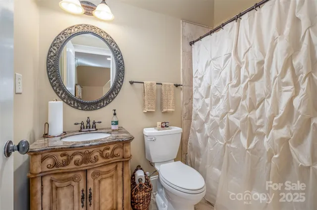 a living room with a fireplace furniture and a large window