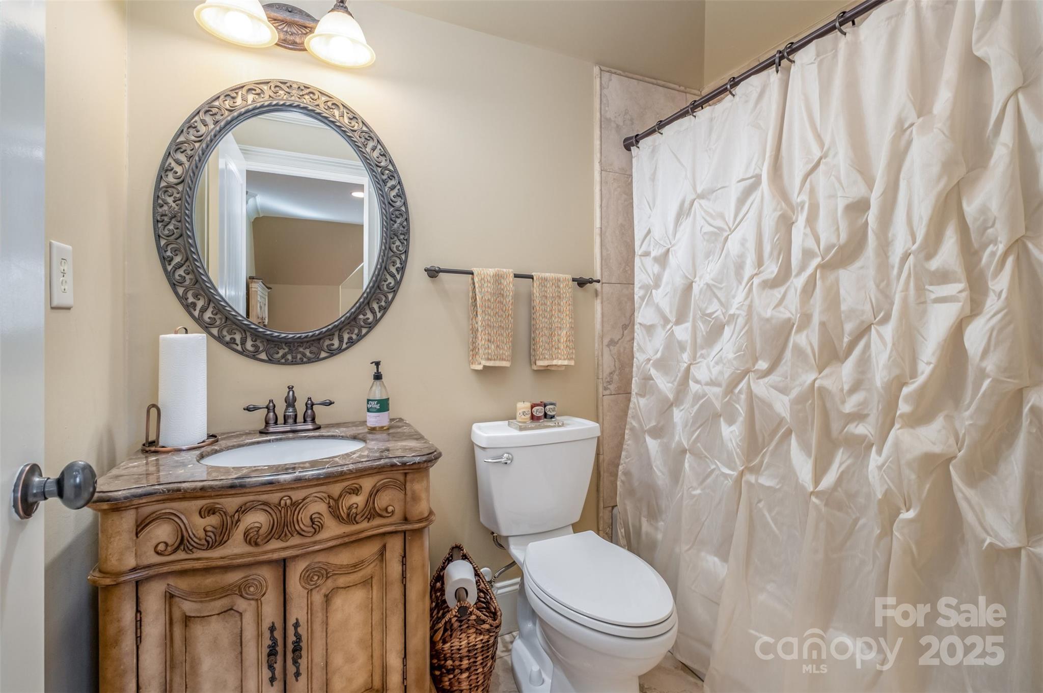 1610 Lookout Circle Waxhaw, NC 28173 - Photo 26 of 44 a bathroom with a toilet sink and mirror